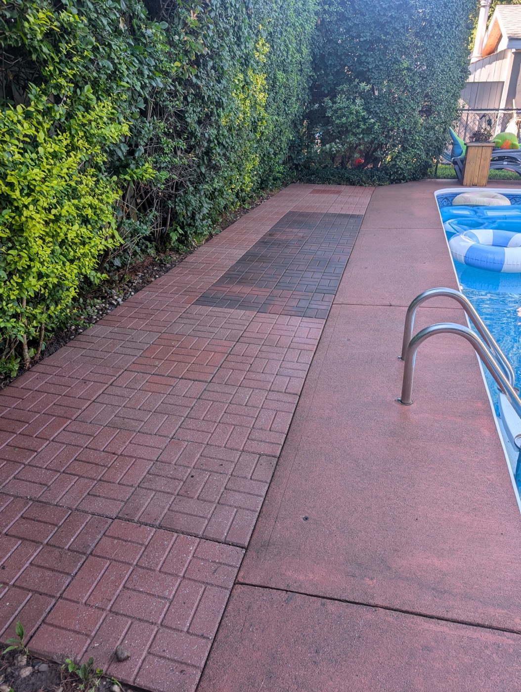 Paver walkway before pressure washing, faded and grimy